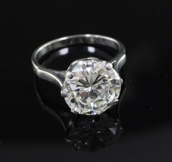A platinum and round brilliant cut solitaire diamond ring, size M.